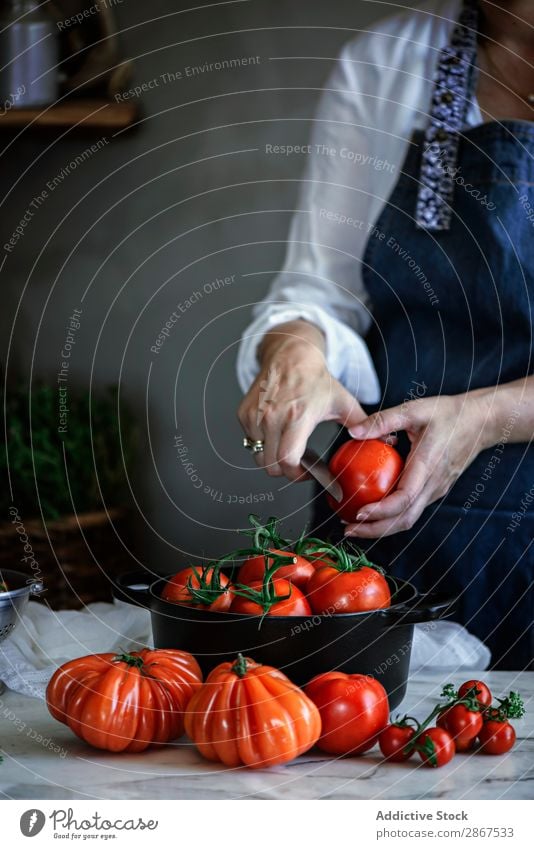 Woman cutting tomatoes in pot at table Tomato Pot Table Vegetable Red Mature Knives Fresh big Food Lady Meal Rustic Healthy Cooking Organic Delicious
