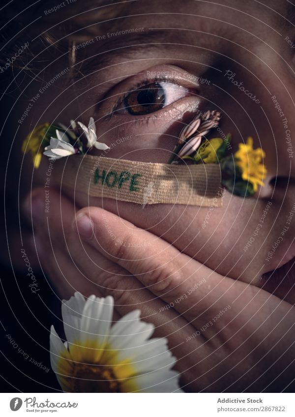 Person with aid stick with hope word and petals on face Face Hope Conceptual design Blossom leave Flower darkness aid band Word Small Fresh Plaster Adhesive