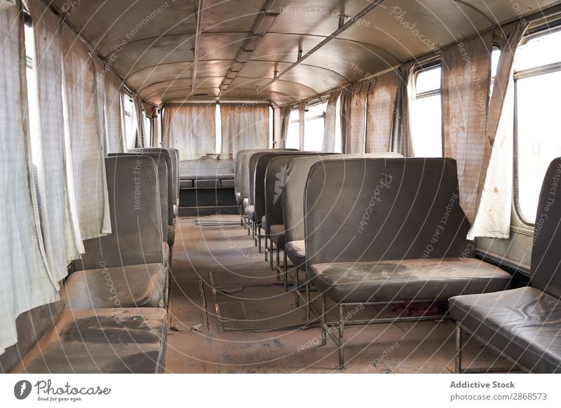 Vintage deserted bus with seats in dust Bus Dust Deserted Seat Marrakesh Morocco Empty Retro Sand Old Grunge Design abandoned Broken curtains Decay Oxydation