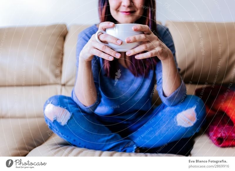 young caucasian woman having coffee at home Breakfast Beverage Coffee Tea Lifestyle Happy Leisure and hobbies Sofa Human being Feminine Young woman