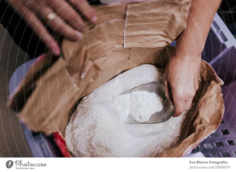 Bag of flour and female hand with scoop Food Dough Baked goods Bread Design Snow Table Gastronomy Human being Feminine Woman Adults Hand 1 45 - 60 years Paper