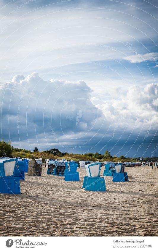 Seating with 10 letters Sand Sky Clouds Storm clouds Baltic Sea Threat Blue Beach chair Sandy beach Cumulus Heaven Colour photo Exterior shot Day