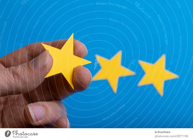 My rating Economy Advertising Industry Business Career Success Hand Fingers Paper Sign Select Movement To hold on Communicate Blue Yellow Star (Symbol) Decision