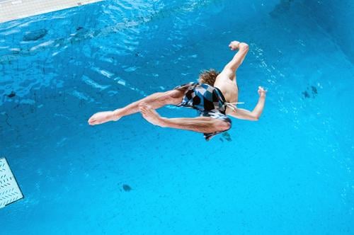 upside down Lifestyle Style Leisure and hobbies Sports Aquatics High diving High diver Swimming pool Human being Young man Youth (Young adults) 1