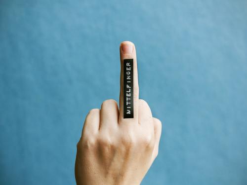 middle finger Hand Fingers Characters Signs and labeling Rebellious Idea Communicate Perspective Protest Middle finger Label Lettering Colour photo