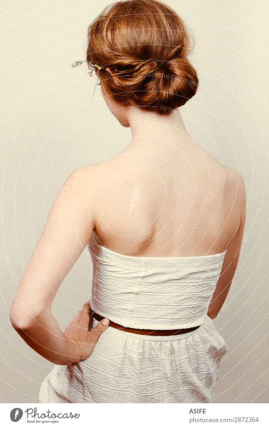 Rear view of a young redhead woman in a white dress with a bun Roll Skin Wedding Human being Feminine Woman Adults Flower Rose Fashion Dress Blonde Red-haired