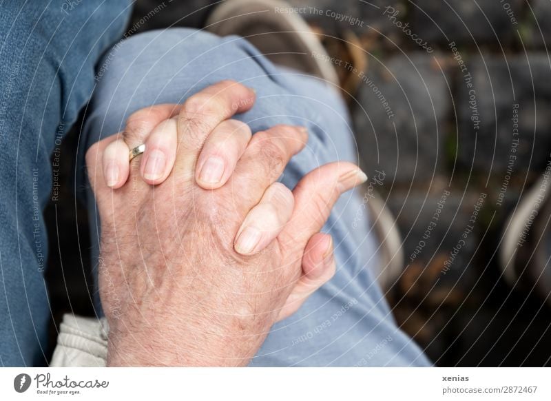 Two hands on one knee Masculine Feminine Woman Adults Man Female senior Male senior Family & Relations Couple Partner Senior citizen Hand Fingers Legs Knee 2