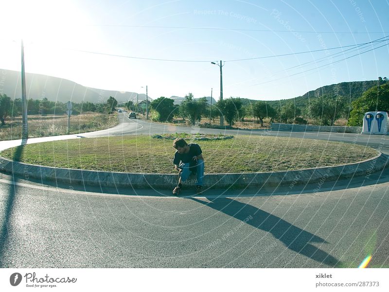 sunny day Summer vacation Young man Youth (Young adults) Body 1 Human being Mountain Town Street Crossroads Road junction Road sign Car Observe Authentic