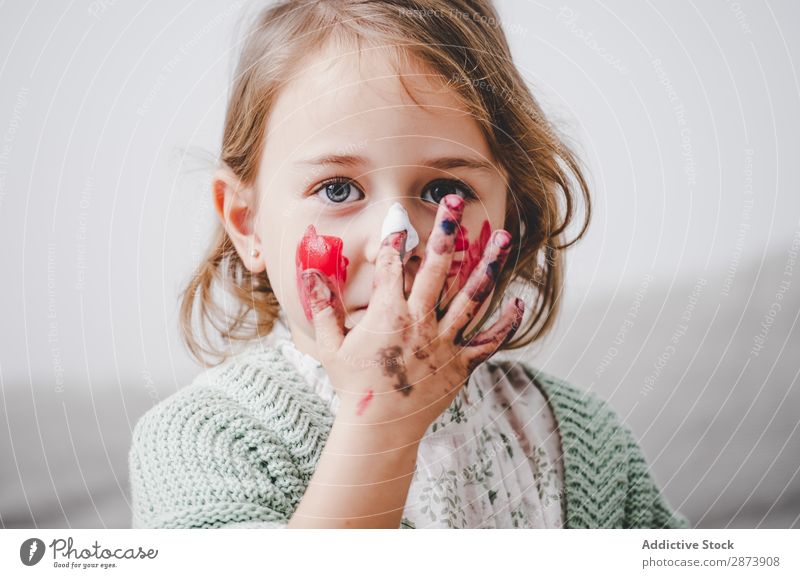 Girl with dirty hands coloring face Hand Dirty Colouring Face Painting (action, artwork) Funny Child Decoration Multicoloured Bright Woman Infancy Preparation