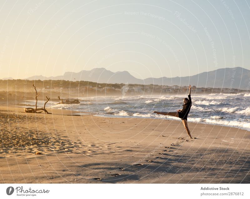 Woman with dancing near water on shore Dancer Coast Water Ocean Sky upped leg waving Sand Blue Youth (Young adults) Ballet Lifestyle Beach Leisure and hobbies