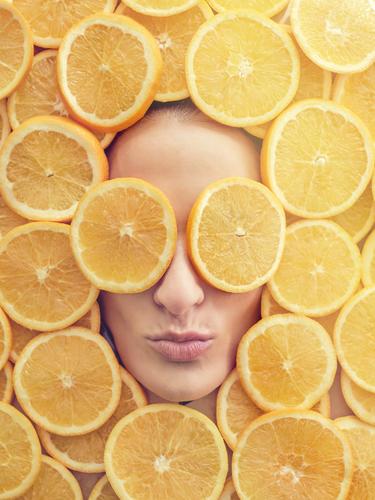 Smiling woman between slices of orange Face Woman Orange Slice Fresh Conceptual design Happy Youth (Young adults) Beautiful Beauty Photography Healthy