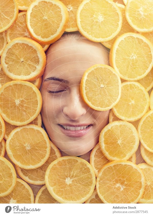 Smiling woman between slices of orange Face Woman Orange Slice Fresh Conceptual design Happy Youth (Young adults) Beautiful Beauty Photography Healthy