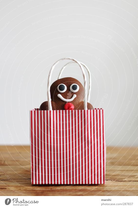 to give away a homemade dream man Food Dessert Candy Nutrition Eating Masculine Brown Red Gingerbread Man Paper bag Christmas & Advent Gift Donate Baked goods
