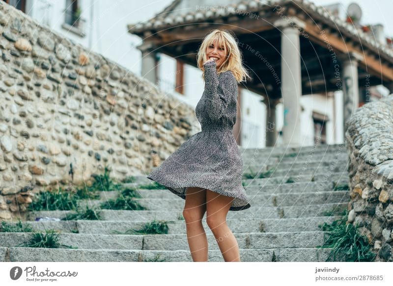 Smiling blonde girl wearing dress dancing outdoors. Lifestyle Style Joy Happy Beautiful Hair and hairstyles Human being Feminine Young woman