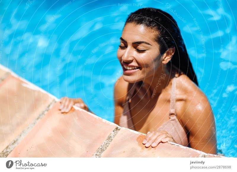 Beautiful Arab woman relaxing in swimming pool. Lifestyle Happy Body Hair and hairstyles Skin Relaxation Swimming pool Leisure and hobbies Vacation & Travel