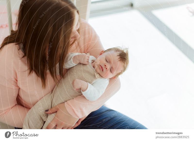 Young Mother holding newborn baby Eating Happy Beautiful Child Baby Woman Adults Parents Family & Relations Infancy Arm Feeding Love Small White Protection