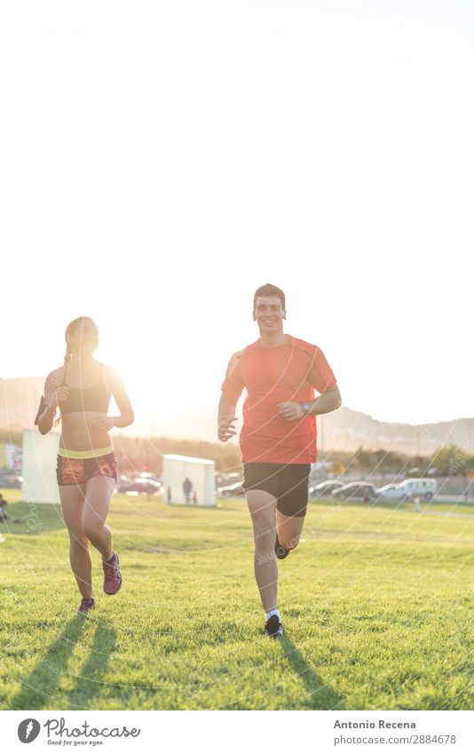 Runner couple Lifestyle Happy Summer Sports Human being Woman Adults Man Couple 2 Nature Park Brunette Fitness Running Muscular young people healthy fit athlete