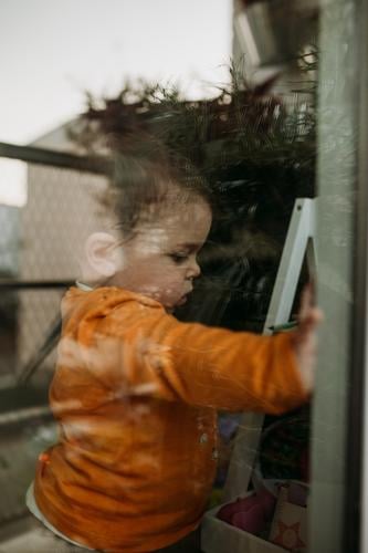 Child through window through glass isolation Quarantine Quarantine period covid-19 Sars-CoV-2 sars indoor coronavirus prevention pandemic Infection