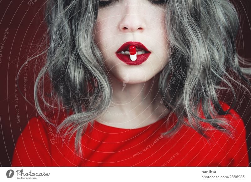 Close up of young woman's lips holding a pill Style Design Hair and hairstyles Skin Face Lipstick Health care Medical treatment Intoxicant Medication