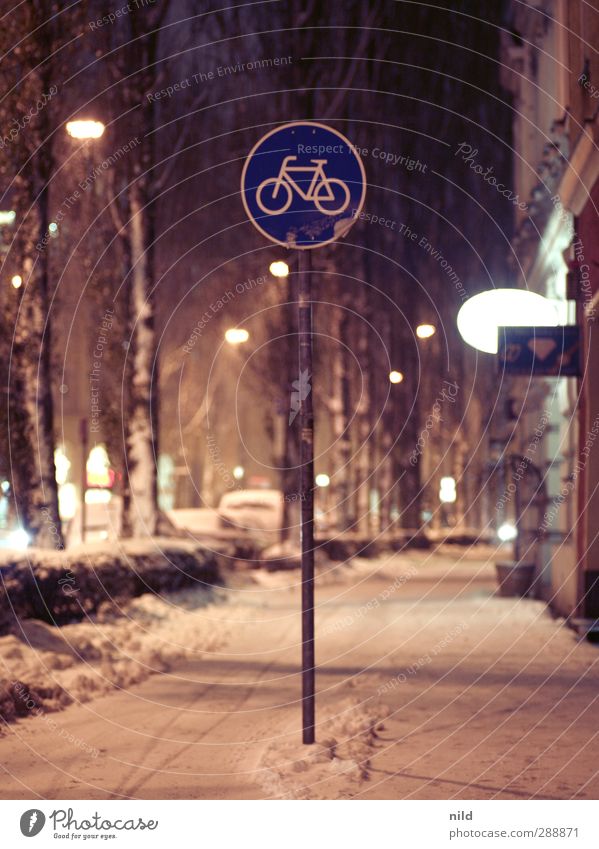 cycle path Cycling Winter Snow Snowfall Munich Town Facade Traffic infrastructure Street Road sign Cycle path Avenue Cold Smoothness Black ice