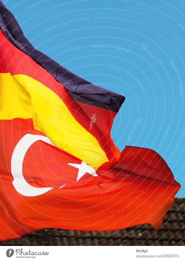 German flag and Turkish flag flying together in the wind. Close-up. German-Turkish german-turkish German Flag Society Cloudless sky Politics and state Germany