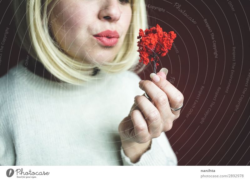 Young woman holding a little red tree Design Human being Woman Adults Art Environment Nature Autumn Tree Growth Authentic Uniqueness Sustainability Red