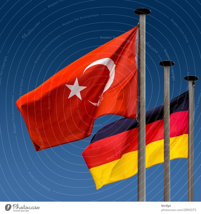 Germany flag and Turkey flag flying side by side in the wind German flag Turkish flag Society Politics and state German Flag Ensign Integration german-turkish