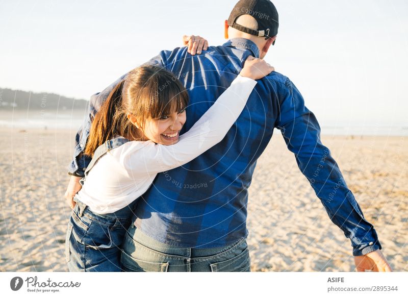 Father and daughter playing piggyback on the beach Joy Happy Beautiful Playing Beach Child Adults Family & Relations Jeans Bald or shaved head Smiling Love