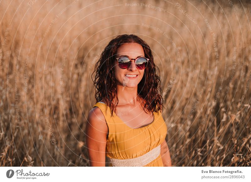 portrait of a Young woman in yellow dress looking at the camera Lifestyle Happy Beautiful Body Vacation & Travel Summer Sun Telephone Technology Internet