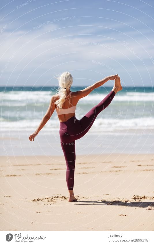 Caucasian woman practicing yoga at seashore. Lifestyle Beautiful Body Harmonious Relaxation Meditation Summer Beach Ocean Sports Yoga Human being Feminine
