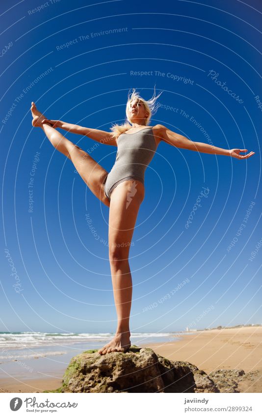 Caucasian blonde woman practicing yoga in the beach Lifestyle Beautiful Body Relaxation Meditation Summer Beach Ocean Sports Yoga Human being Feminine