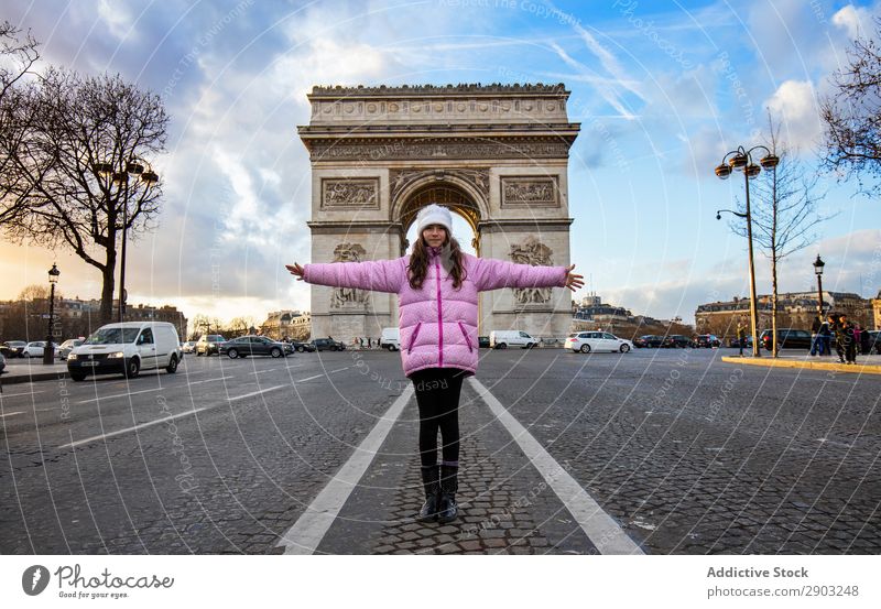 Girl standing against triumphal arch Triumphal Arch Street outstretched arms Tourism City Sky Clouds Freedom Gesture Youth (Young adults) Vacation & Travel Trip