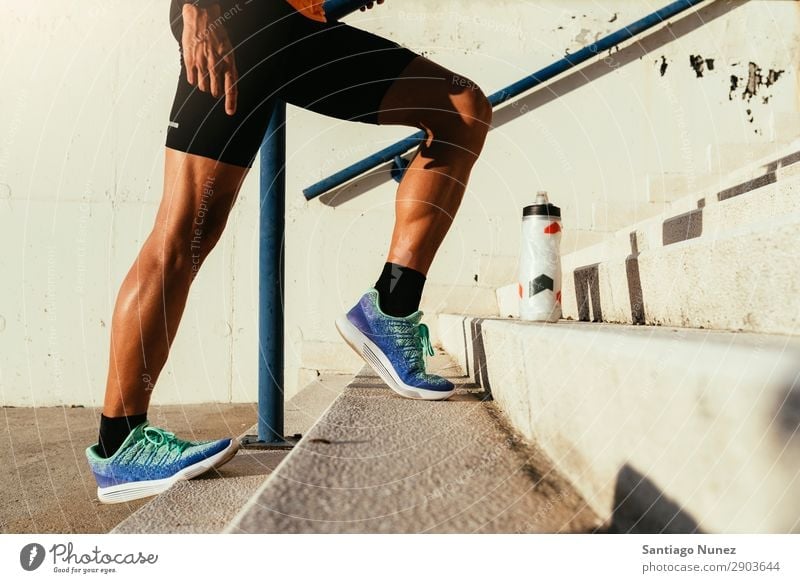 Close up of legs stretching. Man Jogging Running Calf Musculature Runner Stretching Legs Street City Athlete Fitness Lifestyle Youth (Young adults) Town Break