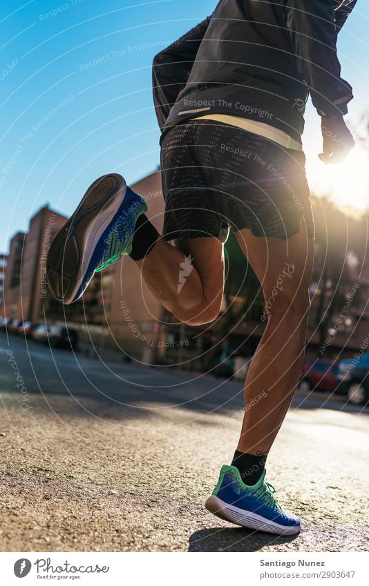 Close up of legs of runner in the city. Man Running Jogging Runner Legs Calf Feet Street City Athlete Speed Fitness Lifestyle Youth (Young adults) Town Action