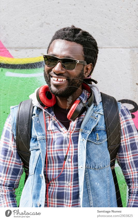 Portrait of a black man smiling. Adults African Afro American Attractive Background picture Black Headphones Easygoing Cool (slang) Expression Face handsome