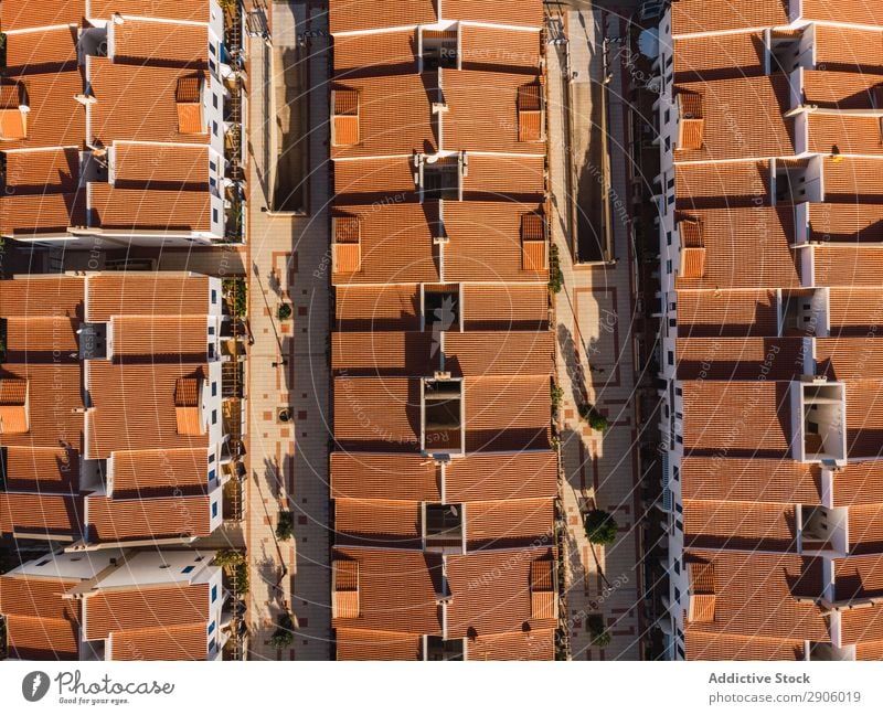 Orange rooftops of modern town from above Town drone view Remote Aircraft Gran Canaria agaete Spain Picturesque Exterior rows City Architecture Building Street