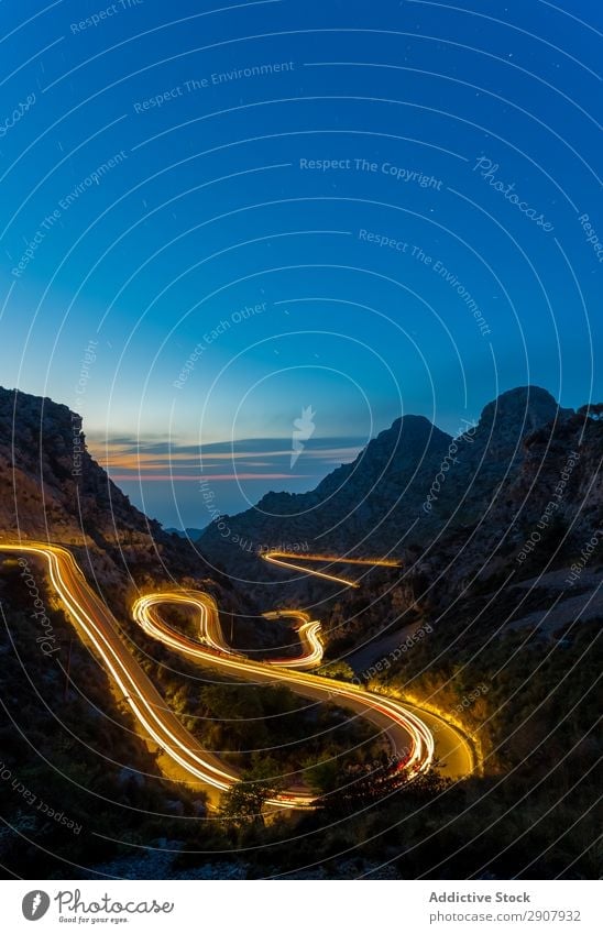 long exposure road at night between mountains Speed Red Light Transport Long Movement Street Exposure Night Scene way Colour Vacation & Travel Landscape Curve