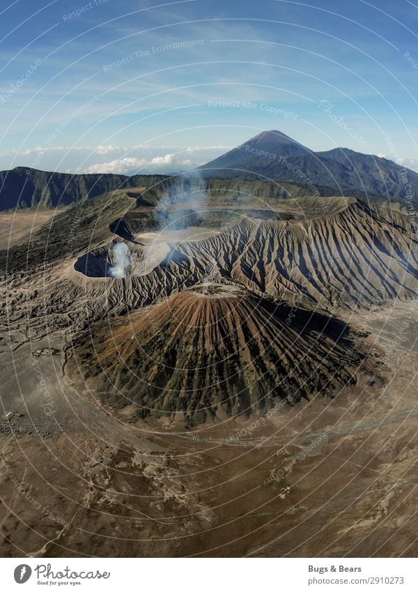 The earth trembles Environment Nature Landscape Elements Earth Sand Mountain Peak Volcano bromo Adventure Indonesia Smoke Vantage point drone