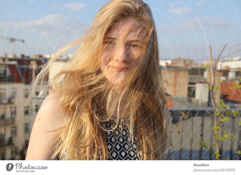 Blond girl with blowing hair on a roof terrace Style Joy Beautiful Hair and hairstyles Life Roof terrace Young woman Youth (Young adults) 13 - 18 years