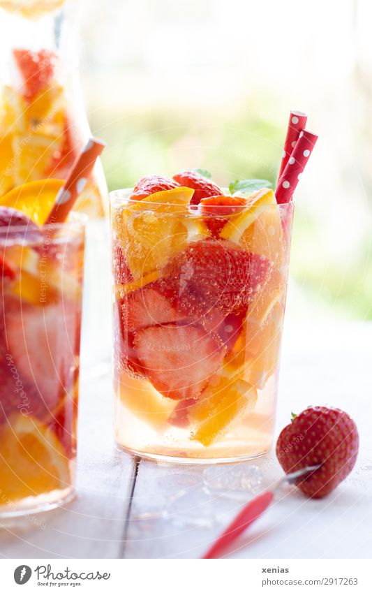 Summer refreshment with orange and strawberries Fruit Orange Strawberry Organic produce Vegetarian diet Beverage Cold drink Drinking water Bottle Glass Fork