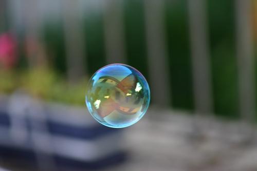 soap bubble Soap bubble Reflection Multicoloured Round Shallow depth of field Air Hover Leisure and hobbies Sphere Flying