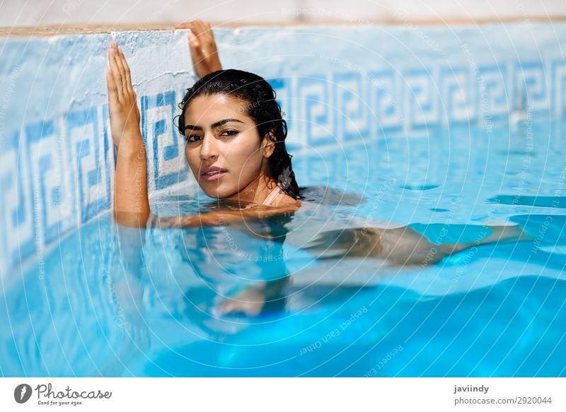 Beautiful Arab woman relaxing in swimming pool. Lifestyle Happy Body Hair and hairstyles Skin Relaxation Swimming pool Leisure and hobbies Vacation & Travel