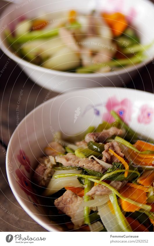 Cambodian Food. Meat Fish Nutrition Lunch Dinner Crockery Bowl To enjoy Vegetable Carrot Leek vegetable Chicken Blossom Pink White Wooden table Table Brown
