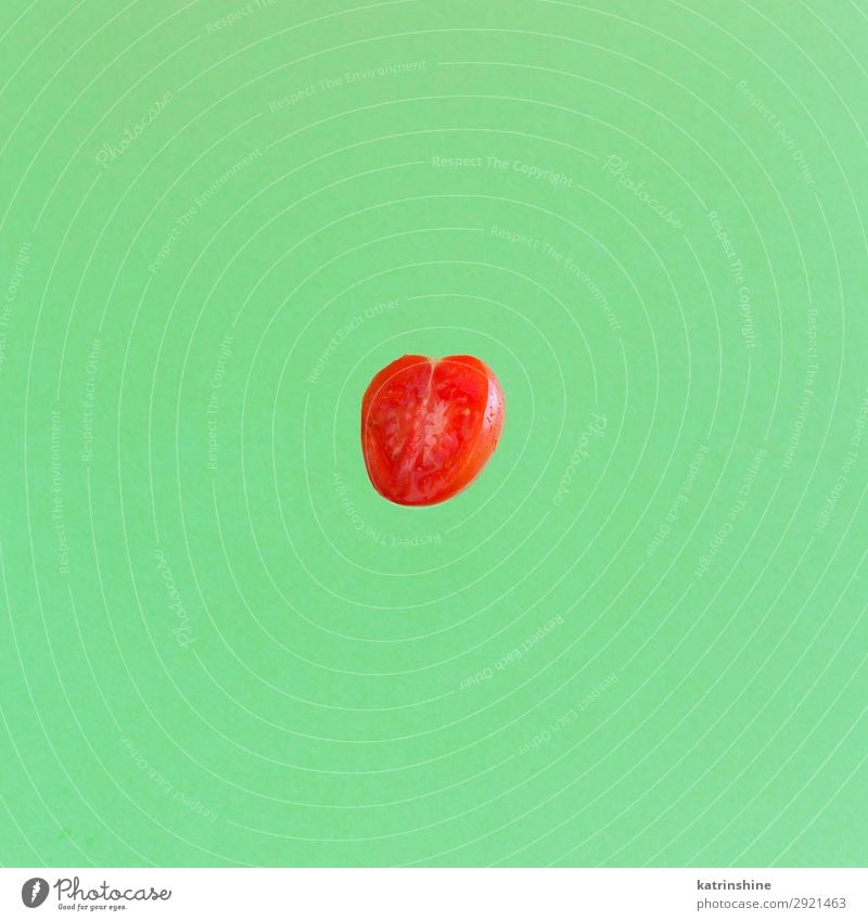 Cherry tomatoe on a green background Vegetable Vegetarian diet Diet Fresh Bright Above Green Red cherry tomatoes Ingredients Raw levitation Minimalistic