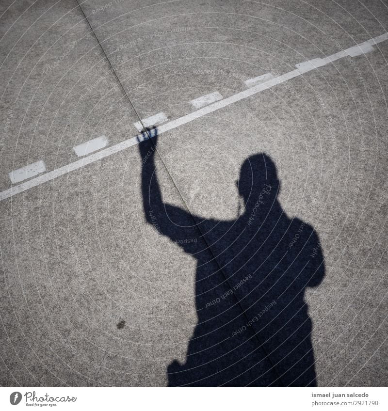 man shadow silhouette on the ground Silhouette Human being Man Shadow Light (Natural Phenomenon) Sun Sunlight Street Ground Exterior shot City Abstract Minimal