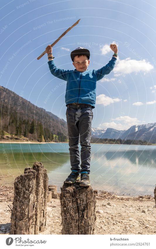 Child standing with wooden stick on a log near a lake Leisure and hobbies Trip Adventure Freedom Hiking Infancy 1 Human being 3 - 8 years Nature Landscape Water