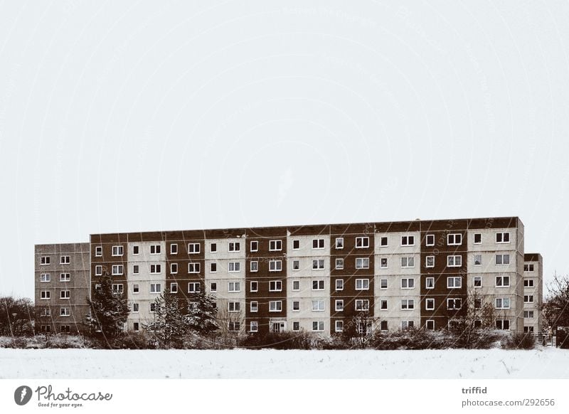The block in the snow Skyline House (Residential Structure) High-rise Manmade structures Building Architecture Old Hideous Cold Brown White Design Elegant