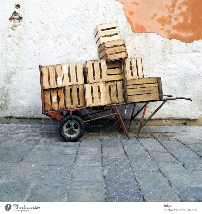 Full load Venice Fishing village Deserted Marketplace Wall (barrier) Wall (building) Facade Wheelbarrow Box Stone Concrete Wood Old Poverty Tall Effort Stress