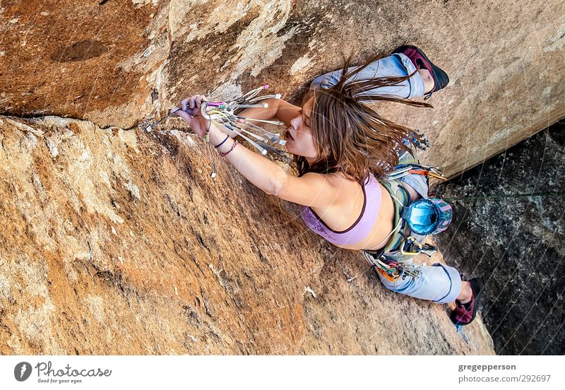 Female climber dangling. Life Adventure Climbing Mountaineering Young woman Youth (Young adults) 1 Human being 18 - 30 years Adults To hold on Authentic