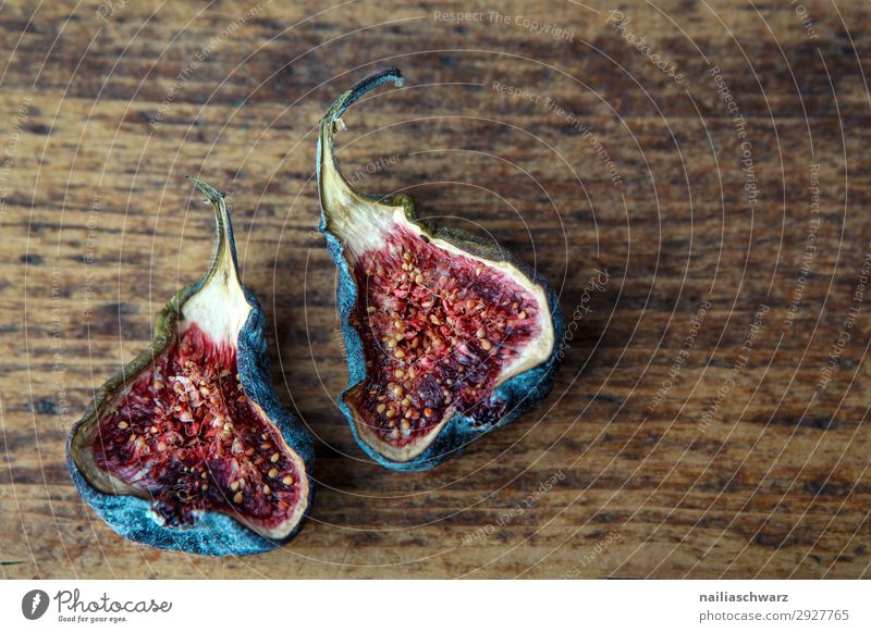 Figs fig halved half board wood dry drying preservation purple red fruit two ripe Flash photo Colour photo Red Sweet Beautiful Delicious Natural Wood Healthy